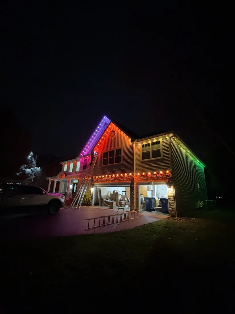 Multicolor holiday roofline lighting install on a home in Wheeling, IL