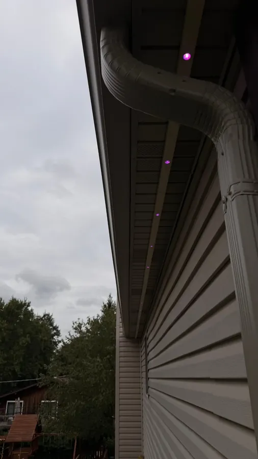 Govee permanent outdoor lights in a white SnapTrack soffit channel, hardware hidden by day - Perfect Touch