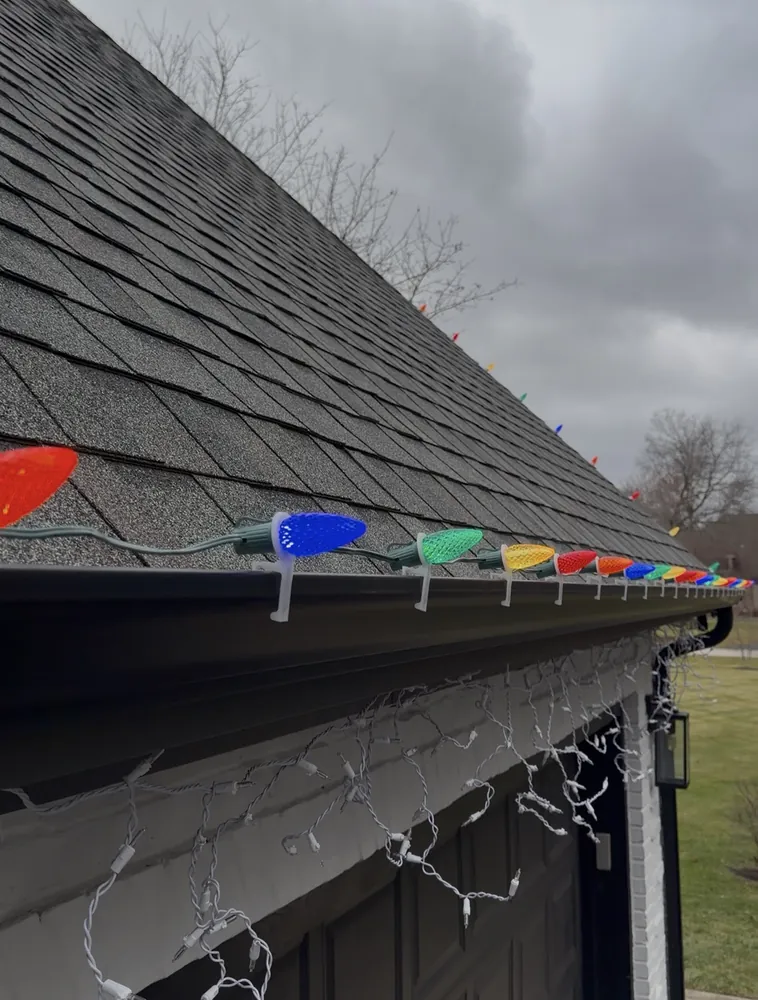 Multicolor C9 Christmas bulbs clipped along a roofline edge in Wheeling, IL - Perfect Touch